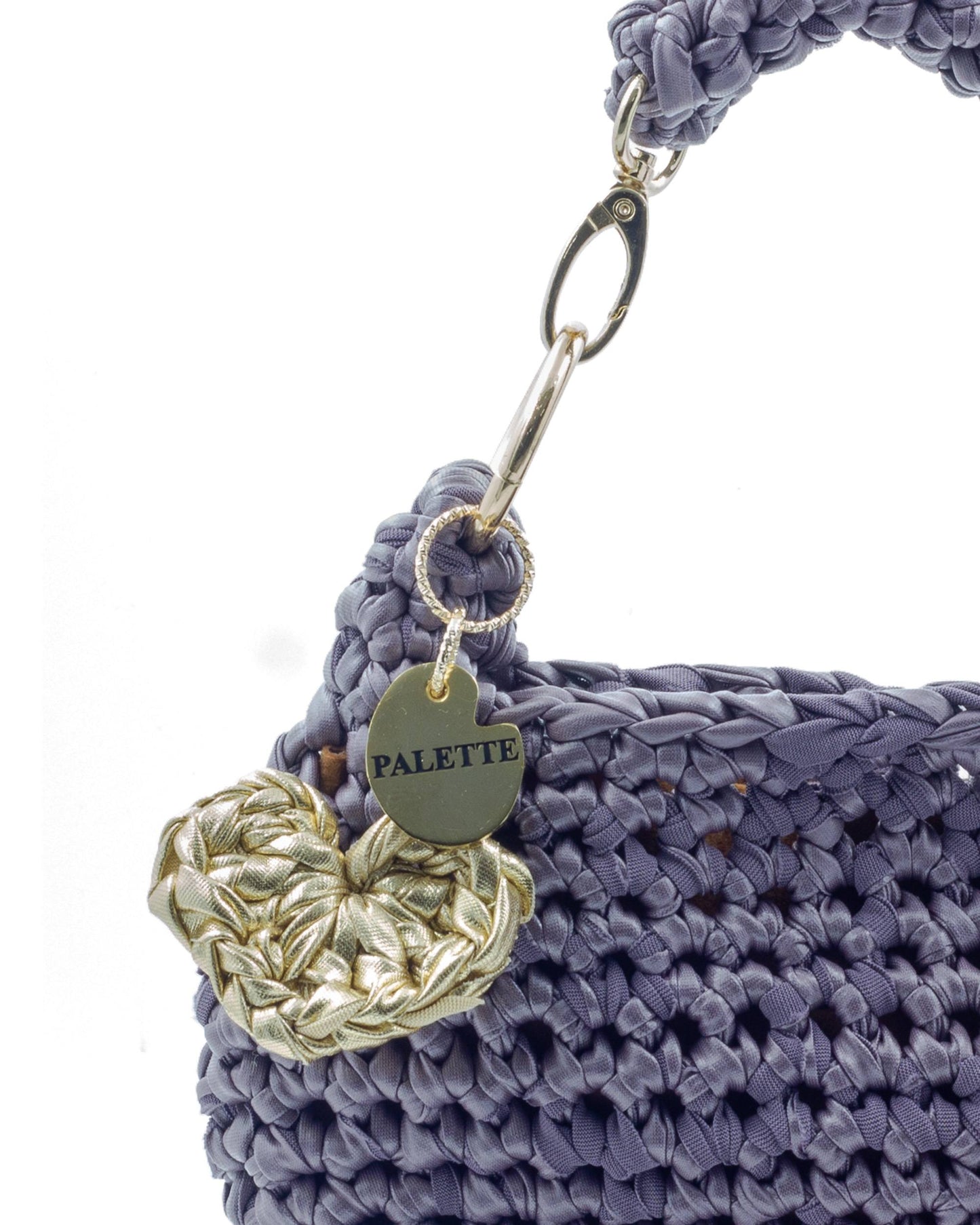 Close-up of hand crochet leatherette stitching on Palette by Rishma Mauve Bag