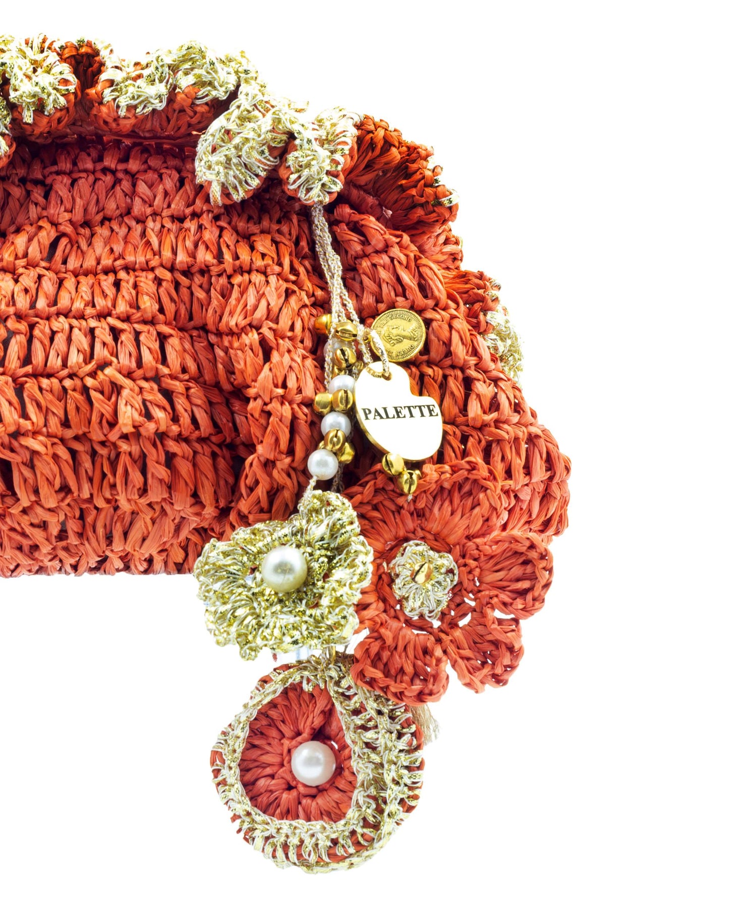 Close-up of hand crochet stitching and crystal beads on Palette by Rishma Orange Pouf Bag
