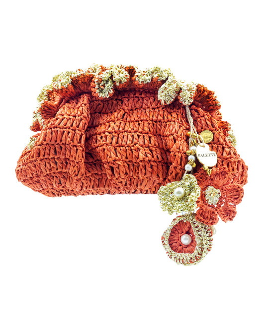 Palette by Rishma Orange Pouf Bag in warm orange — hand crocheted pouf bag in raffia with gota trim, front