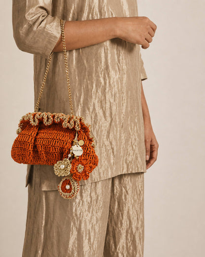 Palette by Rishma Orange Pouf Bag styled — warm orange fête bag being worn