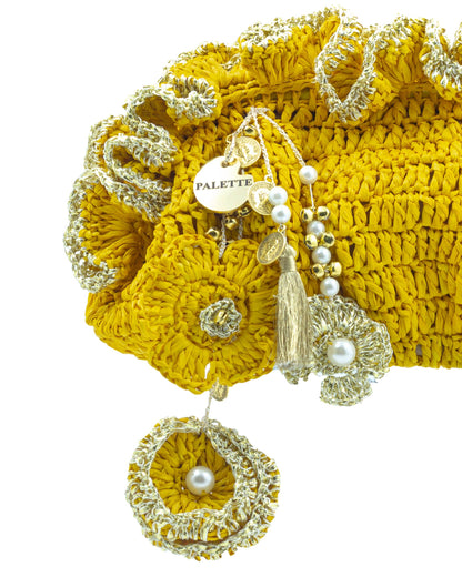 Close-up of hand crochet stitching and crystal beads on Palette by Rishma Yellow Pouf Bag