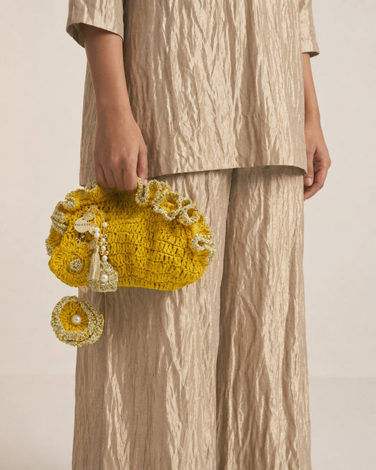 Palette by Rishma Yellow Pouf Bag styled — radiant yellow fête bag being worn