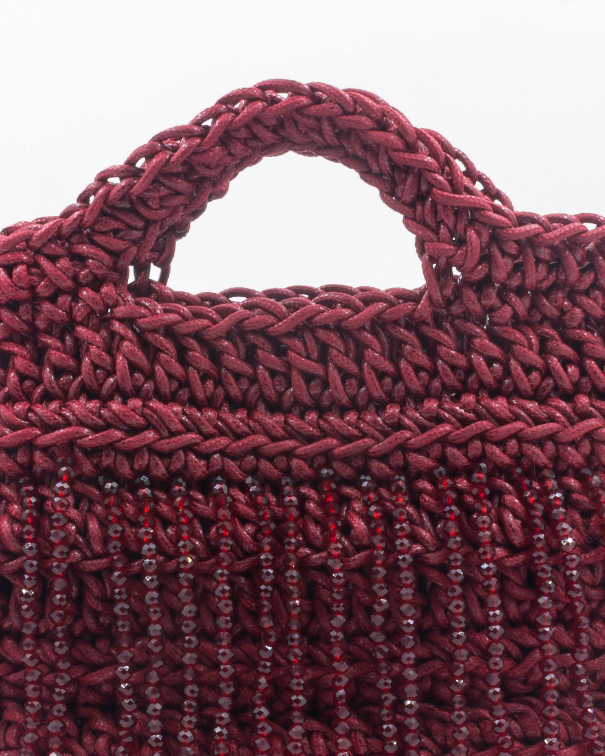 Close-up of hand crochet stitching and crystal beads on Palette by Rishma Camellia Bag