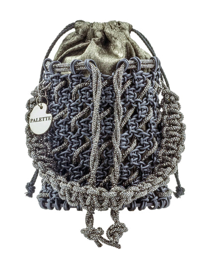 Close-up of hand-knotted macramé lattice and rhinestone detail on Palette by Rishma Onyx Bucket Bag
