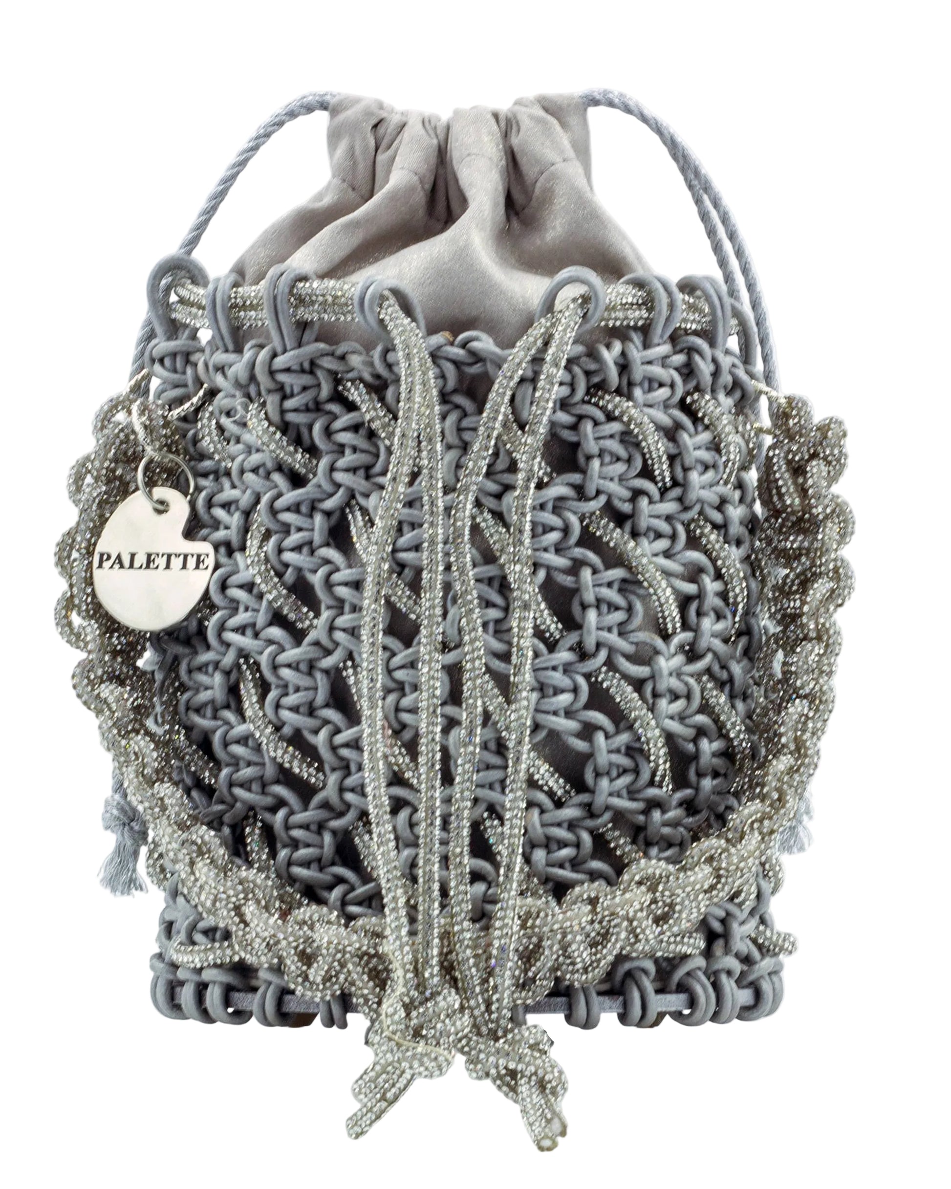 Close-up of hand-knotted macramé lattice and rhinestone detail on Palette by Rishma Sterling Bucket Bag