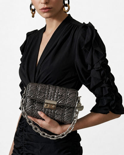 Palette by Rishma Argent Bag worn as a clutch — pewter grey evening bag in use