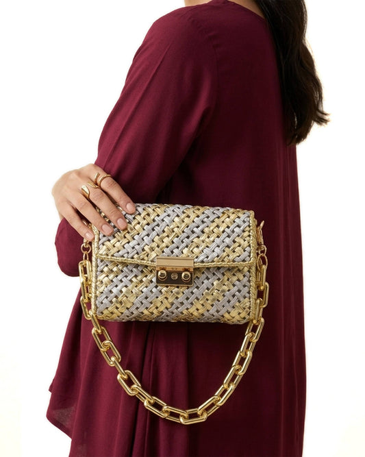 Palette by Rishma Aurum Bag worn as a clutch — gold and silver evening bag in use