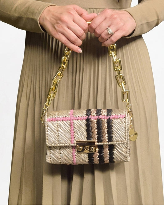 Palette by Rishma Vesper Bag worn as a clutch — champagne, black, pink and rose gold evening bag in use
