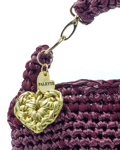Close-up of hand crochet leatherette stitching on Palette by Rishma Mulberry Bag