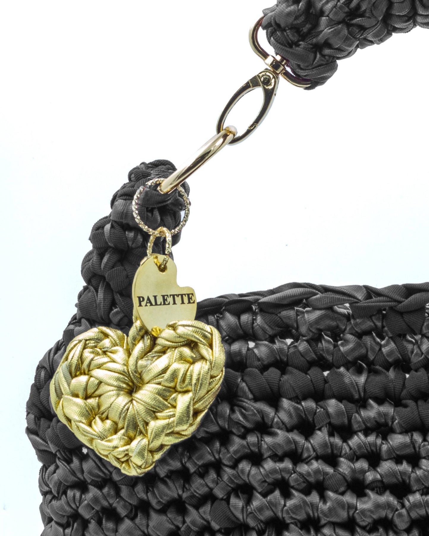 Close-up of hand crochet leatherette stitching on Palette by Rishma Noir Bag