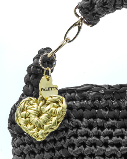 Close-up of hand crochet leatherette stitching on Palette by Rishma Noir Bag
