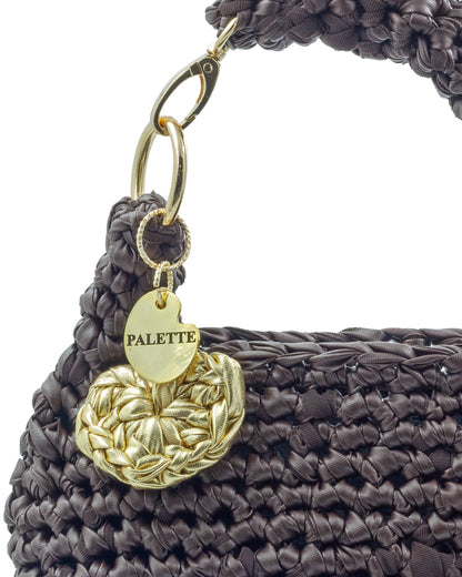 Close-up of hand crochet leatherette stitching on Palette by Rishma Umber Bag